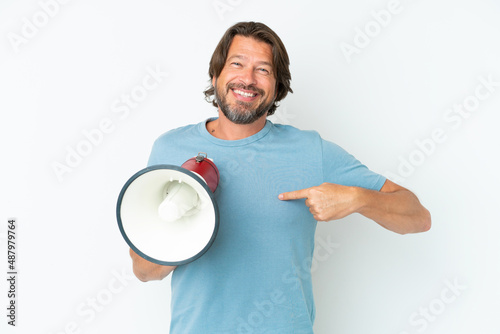 Senior dutch man isolated on white background holding a megaphone and with surprise facial expression