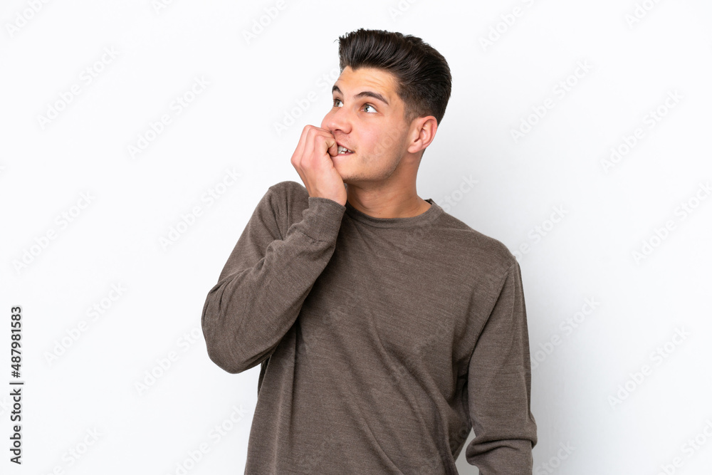 Young handsome caucasian man isolated on white bakcground is a little bit nervous Young handsome caucasian man isolated on white bakcground is a little bit nervous