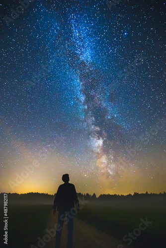 Fototapeta Naklejka Na Ścianę i Meble -  Night sky aesthetics, man looking at the stars