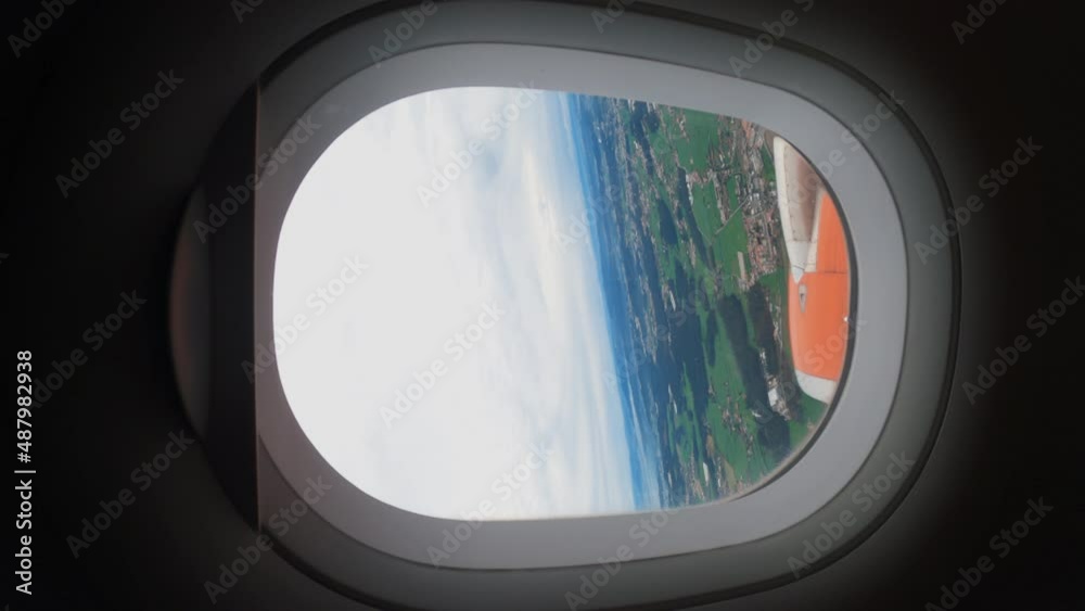 View from The Interior Window of A Commercial Airplane at Low Altitude during Take off - Vertical
View from The Interior Window of A Commercial Airplane at Low Altitude during Take off - Vertical
