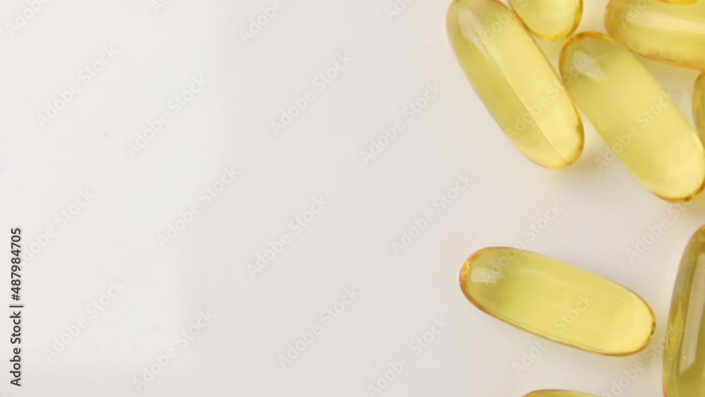 Rotation Closeup fish oil capsules Omega 3 isolated on white background, Health care concept, macro. Rotation Closeup fish oil capsules Omega 3 isolated on white background, Health care concept, macro.