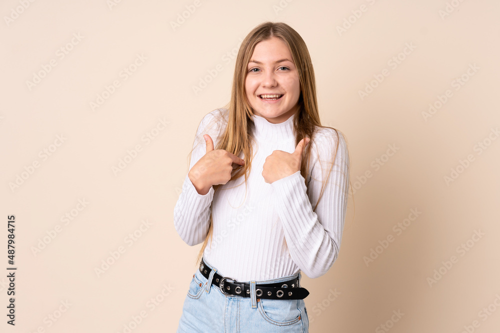 Teenager Ukrainian girl isolated on beige background with surprise facial expression Teenager Ukrainian girl isolated on beige background with surprise facial expression