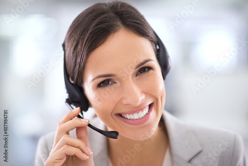 She goes the extra mile for her clients. Shot of an attractive customer support agent.