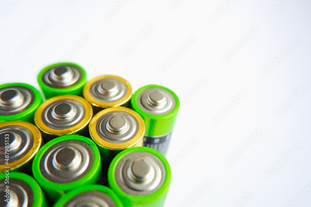 Several AA batteries close-up photo. Used Batteries , Waste, Collection And Recycling. Closeup of pile of alkaline batteries. Energy supply and storage, electro-waste and recycling concept Several AA batteries close-up photo. Used Batteries , Waste, Collection And Recycling. Closeup of pile of alkaline batteries. Energy supply and storage, electro-waste and recycling concept