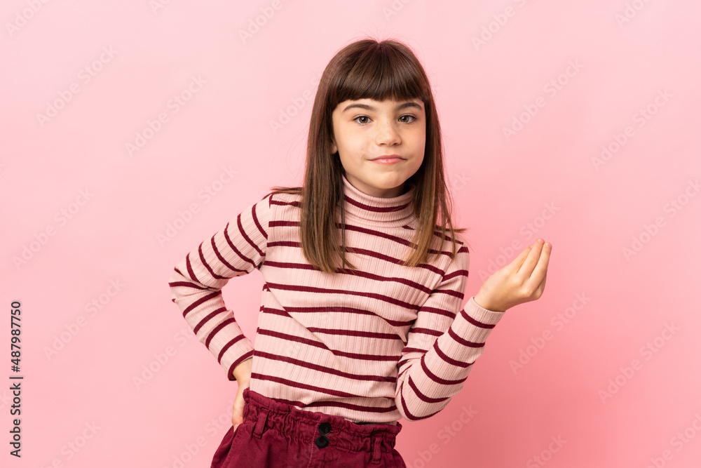 Little girl isolated on pink background making Italian gesture Little girl isolated on pink background making Italian gesture