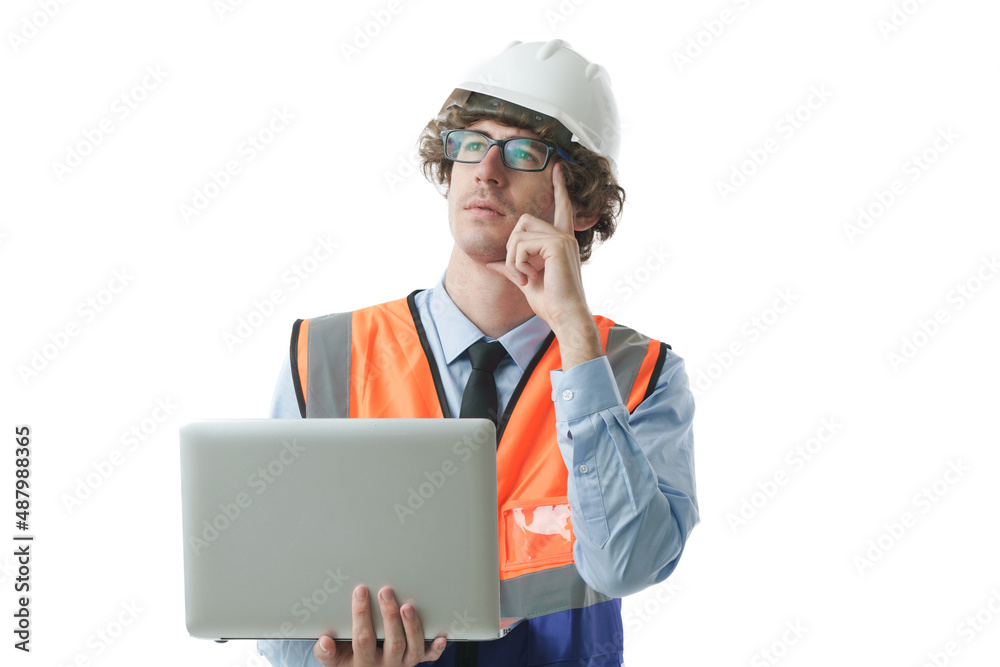Young Caucasian civil engineer, construction worker wearing hard hat and safety uniform looking up thinking and holding laptop, isolated in white background, industrial occupation portrait concept. Young Caucasian civil engineer, construction worker wearing hard hat and safety uniform looking up thinking and holding laptop, isolated in white background, industrial occupation portrait concept.
