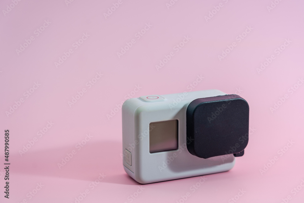 Action camera isolated on pink background. Video & Photo Camera Action camera isolated on pink background. Video & Photo Camera