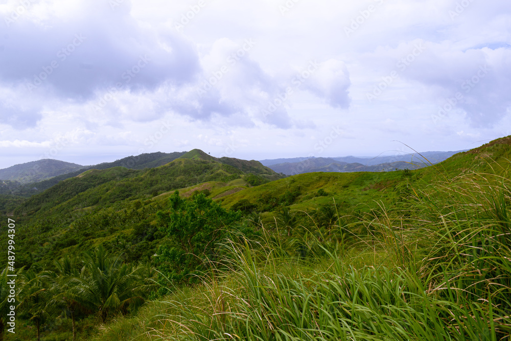 Wide landscape along the blue sky. Cabaliwan Peak, Romblon, Philippines