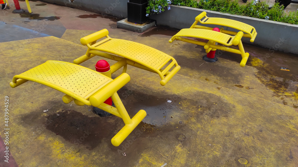 Photo of yellow sports equipment in a public space in the Cicalengka Square, Indonesia