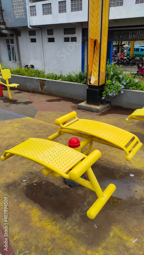 Photo of yellow sports equipment in a public space in the Cicalengka Square, Indonesia © Adam