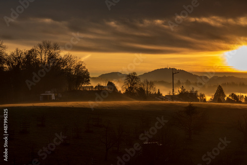 Winter sunrise in the Zurcher Oberland region with the Alps in the background photo