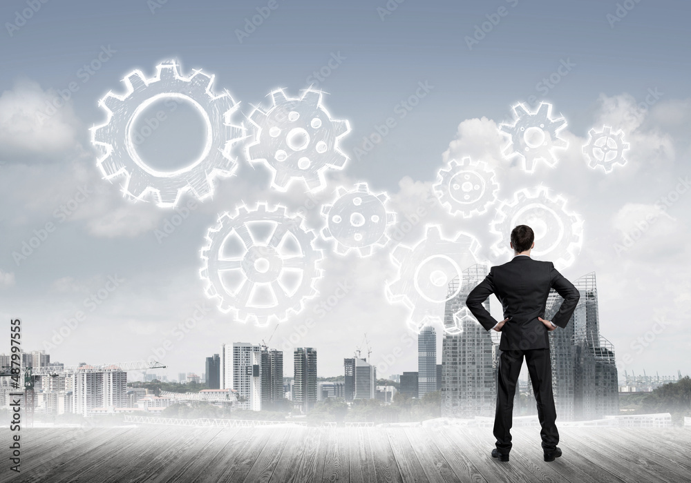 Cogwheel engine drawn on screen as symbol for teamwork and cooperation Cogwheel engine drawn on screen as symbol for teamwork and cooperation