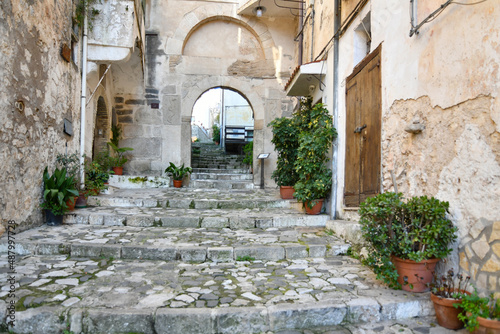 A small street between the old houses of Itri, a medieval town in the Lazio region. photo