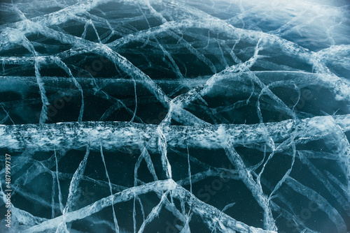 The beautiful Baikal ice with magical cracks before your eyes. This is really cool. The camera moves down the ice. Extreme close-up view