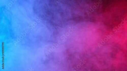Red, blue, purple smoke on black background
