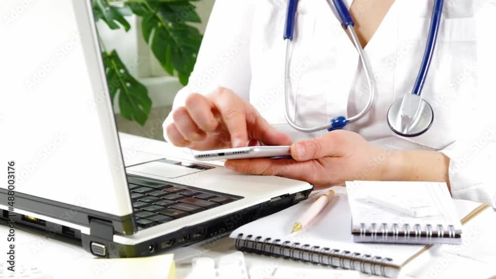 Female doctor work on laptop