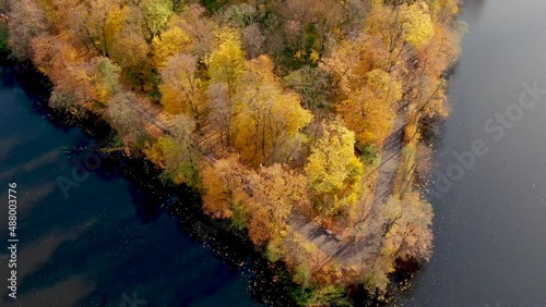 Scenic aerial flight over mist above forrest lake at sunrise, 4K footage. Colorful autumn trees at early morning light. Epic glory inspiration background. Pałac Bielinskich w Otwocku Wielkim photo