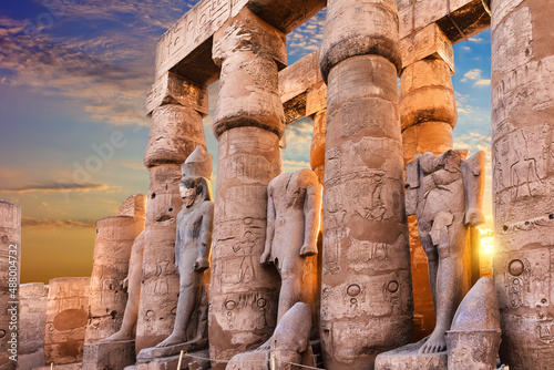 Obraz na płótnie Standing Ramses II statues in Luxor Temple, beautiful sunset view, Egypt w salonie