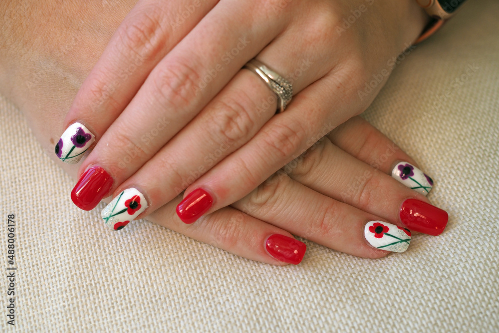 Painted acrylic nails with poppy remembrance theme Painted acrylic nails with poppy remembrance theme