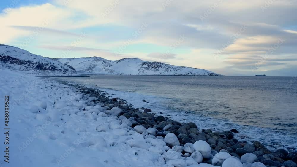 The shore of the Arctic Ocean in the city of Teriberka. Barents Sea at the end of February.