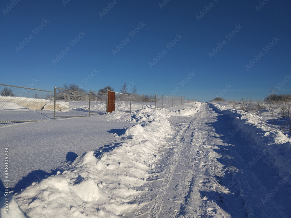 Winter landscape in a Russian village on a sunny day