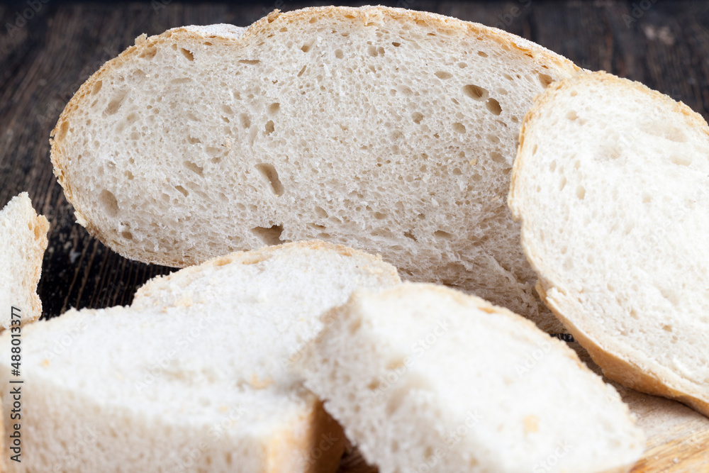sliced pieces of gray bread from second-rate flour