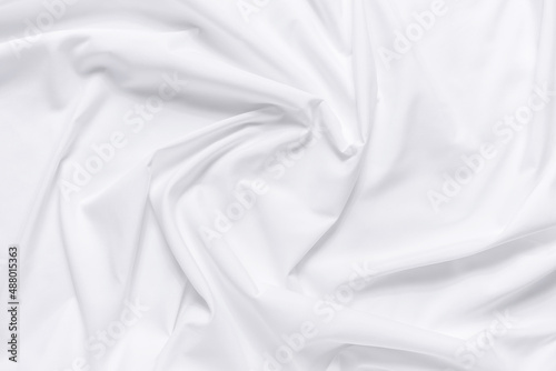 White fabric texture background. Cloth soft wave. Creases of satin, silk, and cotton.