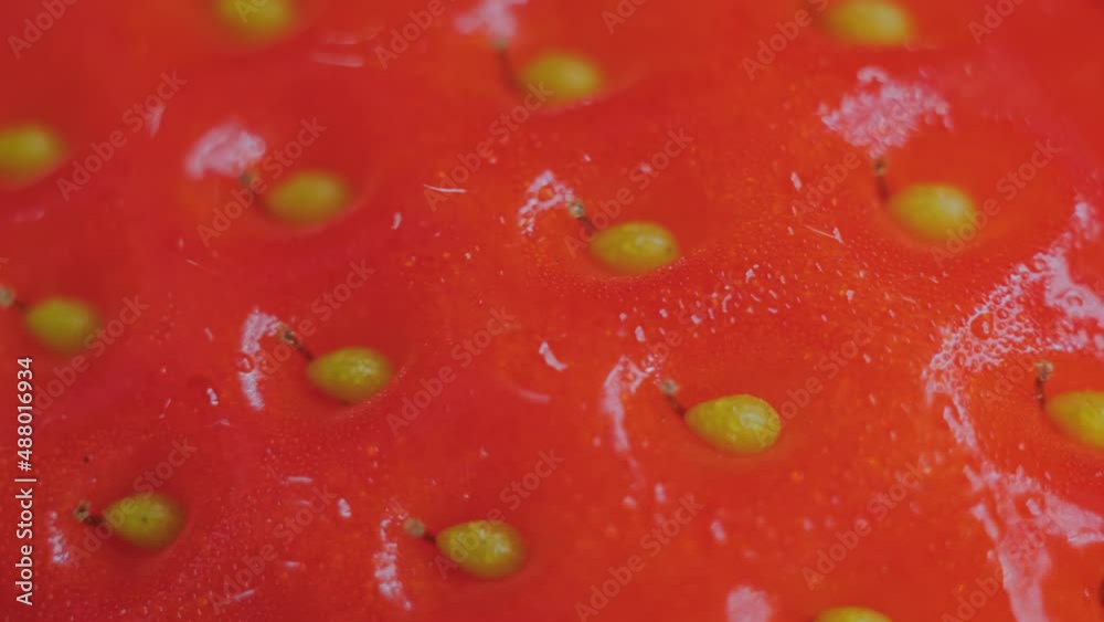 Top view: fresh juicy red strawberry on rotating surface - close up, macro. Organic, summer and healthy food concept Top view: fresh juicy red strawberry on rotating surface - close up, macro. Organic, summer and healthy food concept