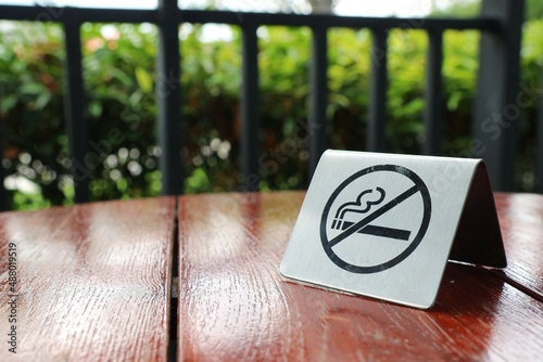No smoking area sign in the outdoor restaurant or the public park. Sign, healthcare, and environment concept.