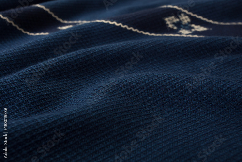 Close up of texture of hand woven shawl, Thai cotton indigo dyed
