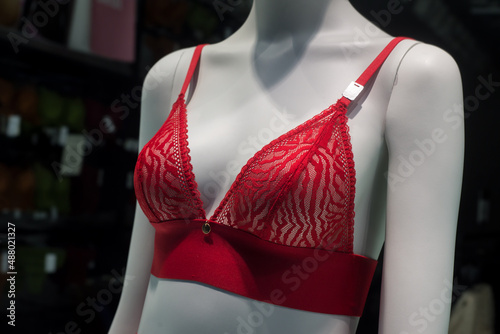 Closeup of red bra on mannequin in a fashion store showroom