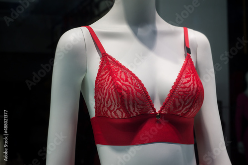 Closeup of red bra on mannequin in a fashion store showroom