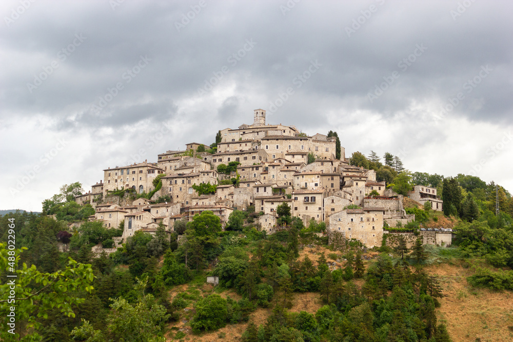 Little italian old town on the top of the hill, province of Rieti, Lazio, during a cloudy day