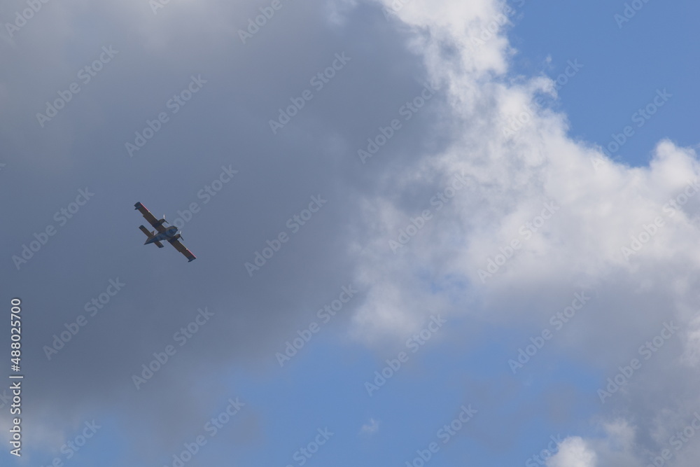 Airplane silhouette on the background of the sky with clouds Airplane silhouette on the background of the sky with clouds