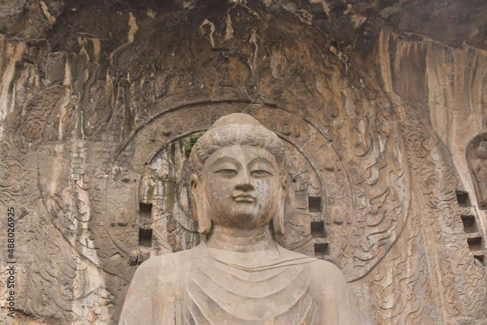 Buddha Statue Carving at Longmen Grottoes in Luoyang, Henan Province, China