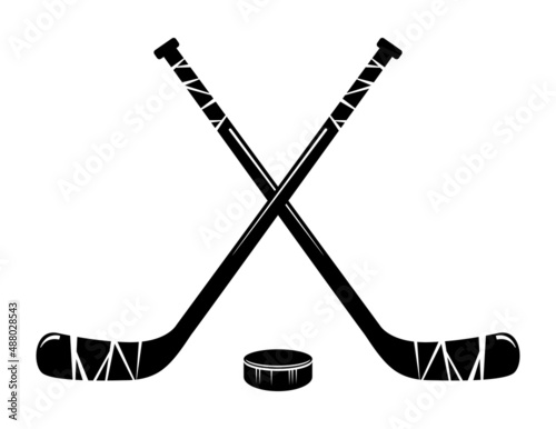 vector crossed hockey sticks and hockey puck photo