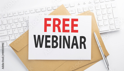 Text FREE WEBINAR on the envelope on the keyboard