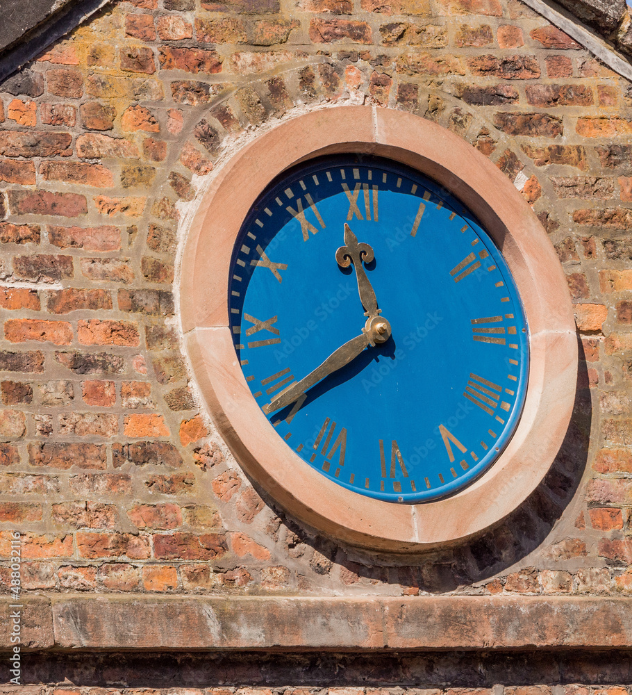 Fototapeta premium The old mill clock at Quarry Bank Mill, Styl, Cheshire, UK