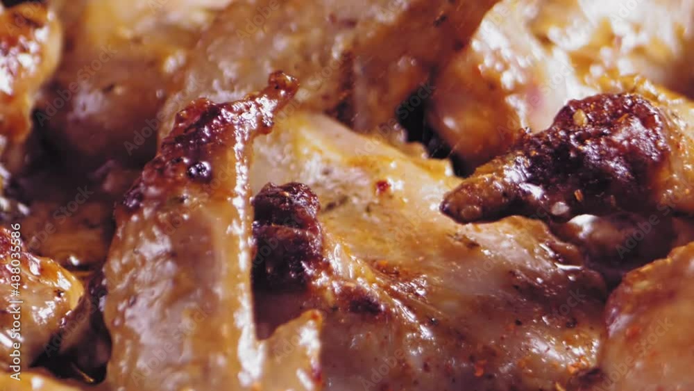Spices are sprinkled on chicken wings and fried in boiling oil. Spices are sprinkled on chicken wings and fried in boiling oil.