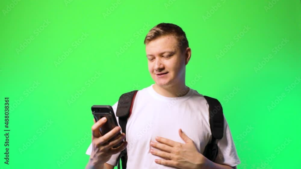 young man student communicates via video call flirting dating chroma key background.concept dating app young man student communicates via video call flirting dating chroma key background.concept dating app