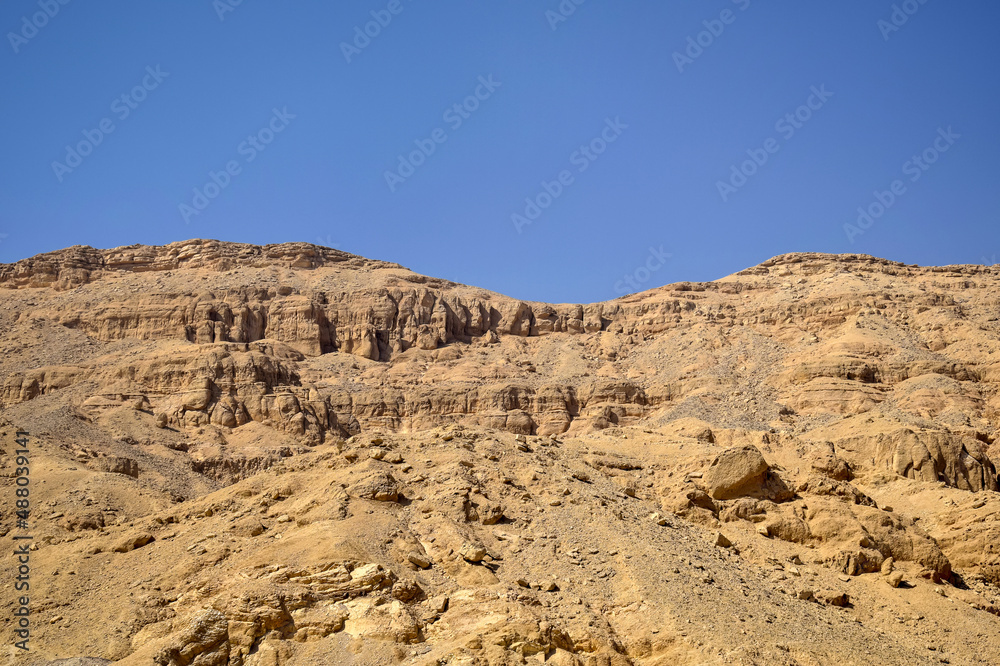 Desert landscape in Egypt. View of sandy hill against clear sky. Selective focus.
