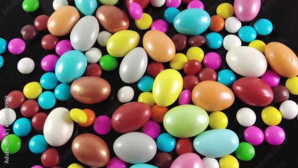 Colorful chocolate candies slow motion