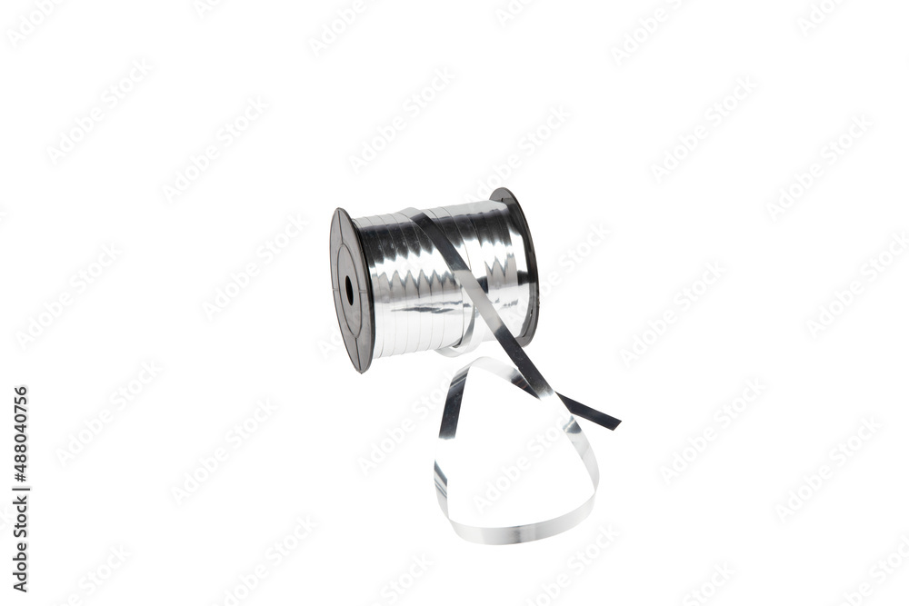 Paper packaging tape on a white background. Gift wrapping. Making bows, flowers for gifts from paper ribbons, colored ribbons in skeins. Paper packaging tape on a white background. Gift wrapping. Making bows, flowers for gifts from paper ribbons, colored ribbons in skeins.