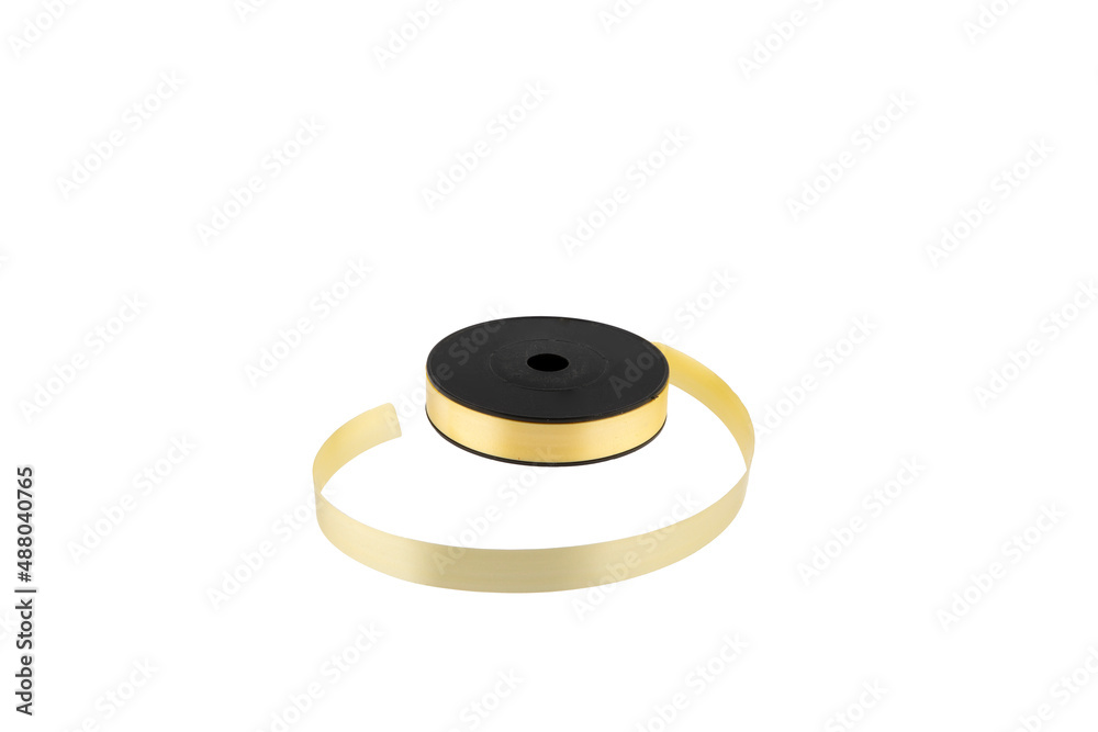 Paper packaging tape on a white background. Gift wrapping. Making bows, flowers for gifts from paper ribbons, colored ribbons in skeins. Paper packaging tape on a white background. Gift wrapping. Making bows, flowers for gifts from paper ribbons, colored ribbons in skeins.