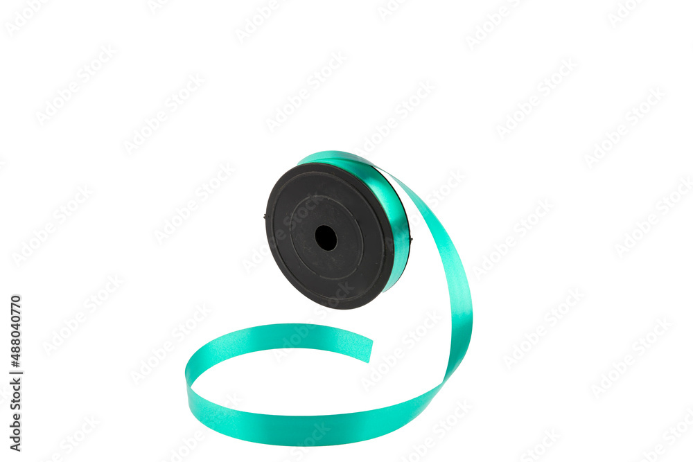 Paper packaging tape on a white background. Gift wrapping. Making bows, flowers for gifts from paper ribbons, colored ribbons in skeins. Paper packaging tape on a white background. Gift wrapping. Making bows, flowers for gifts from paper ribbons, colored ribbons in skeins.