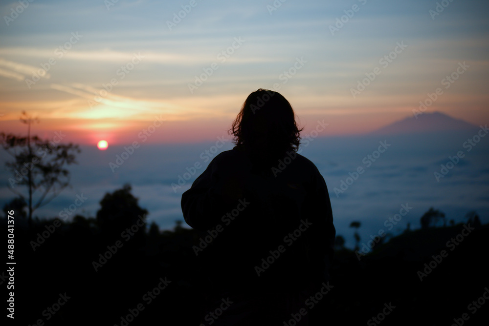 silhouette on the mountain at sunrise