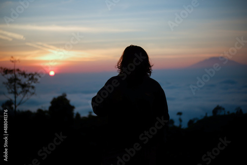 silhouette on the mountain at sunrise