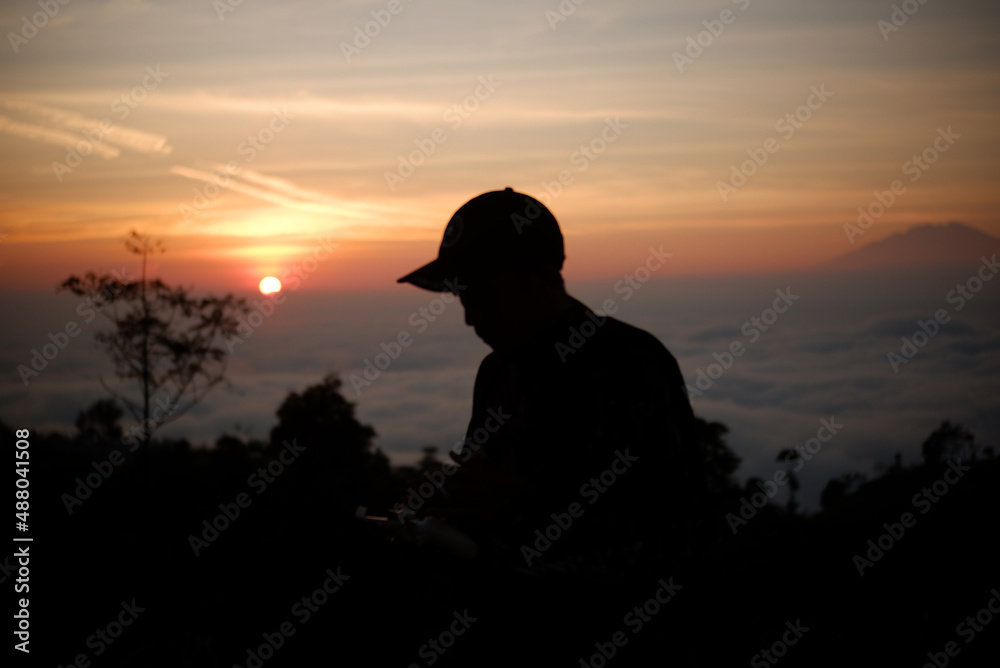 silhouette on the mountain at sunrise