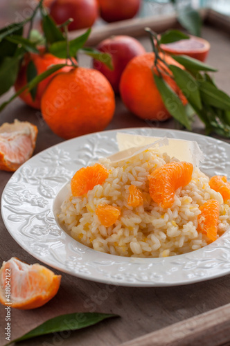 Tangerine Citrus Risotto Garnished with Shaved Cheese and Tangerine Segments