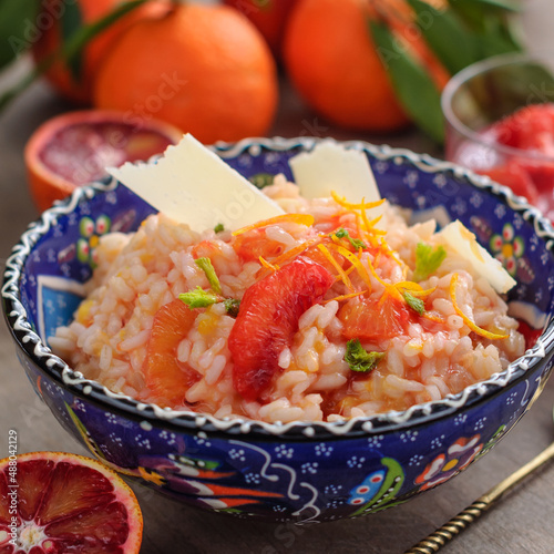 Blood Orange Citrus Risotto Garnished with Shaved Cheese and Orange Segments